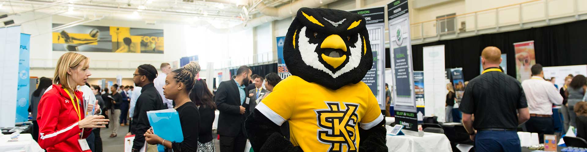 KSU mascot Scrappy at career fair with students and employers networking